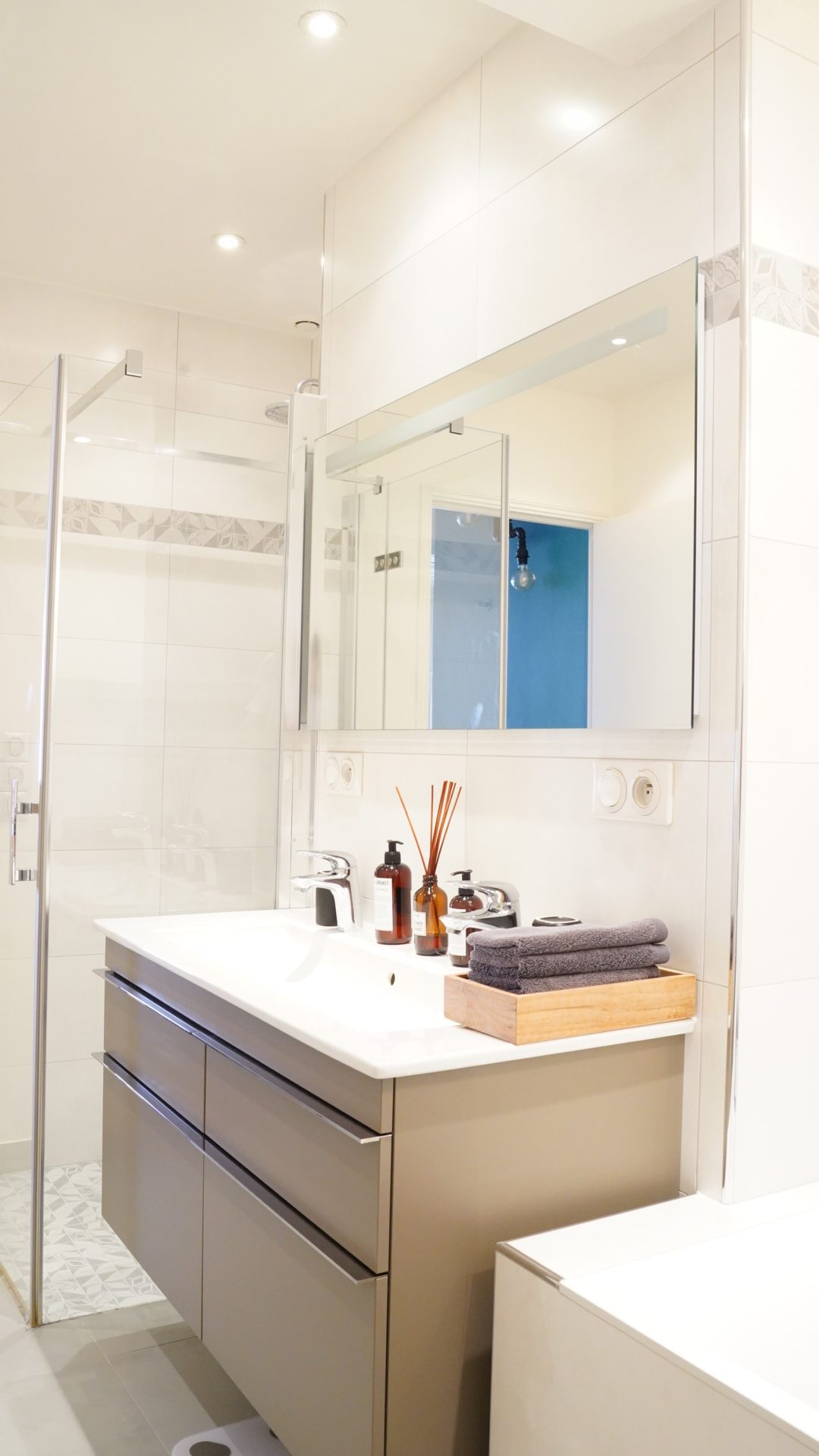 The vanity and walk-in shower