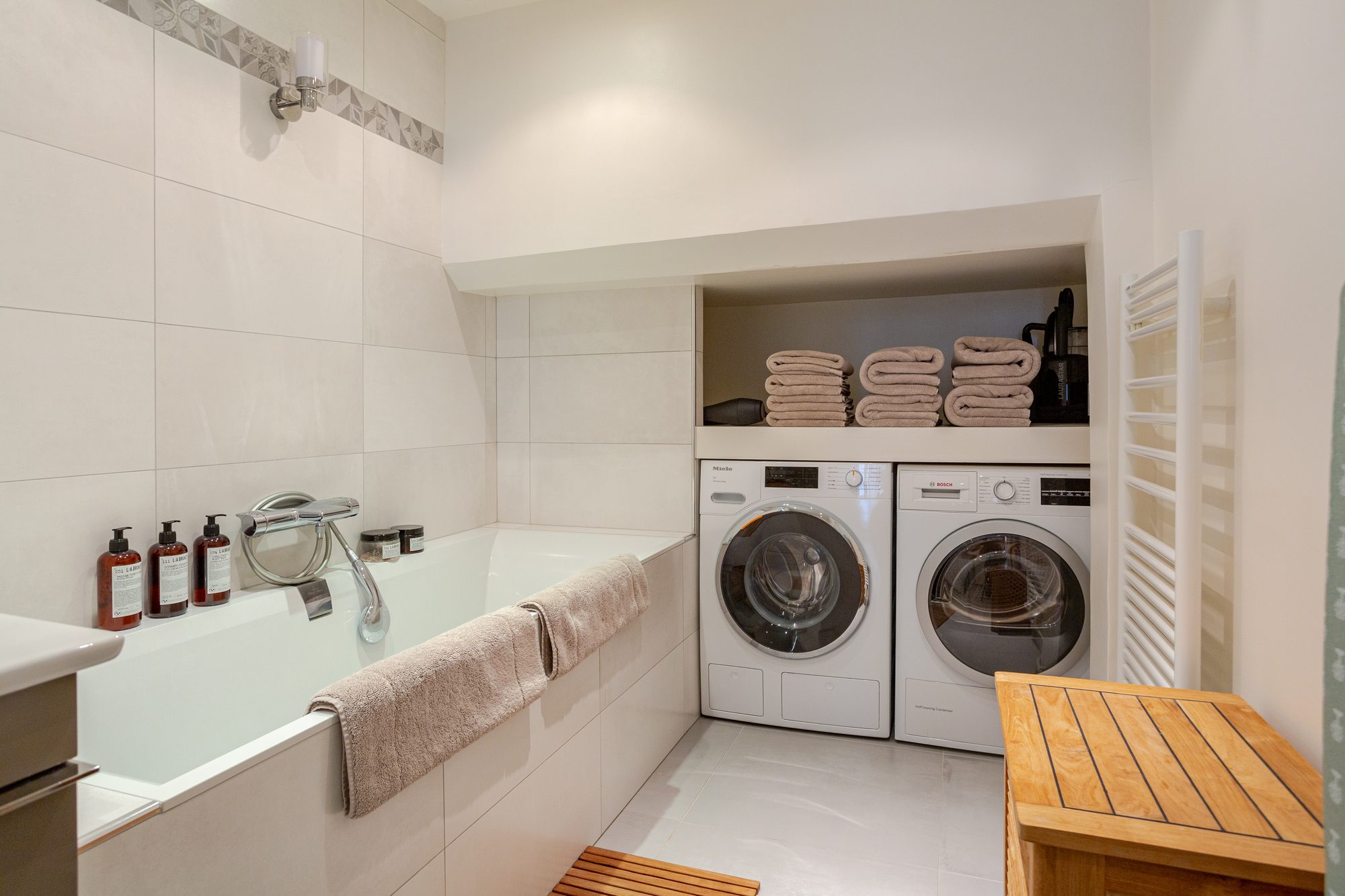 The bathroom with bath and laundry